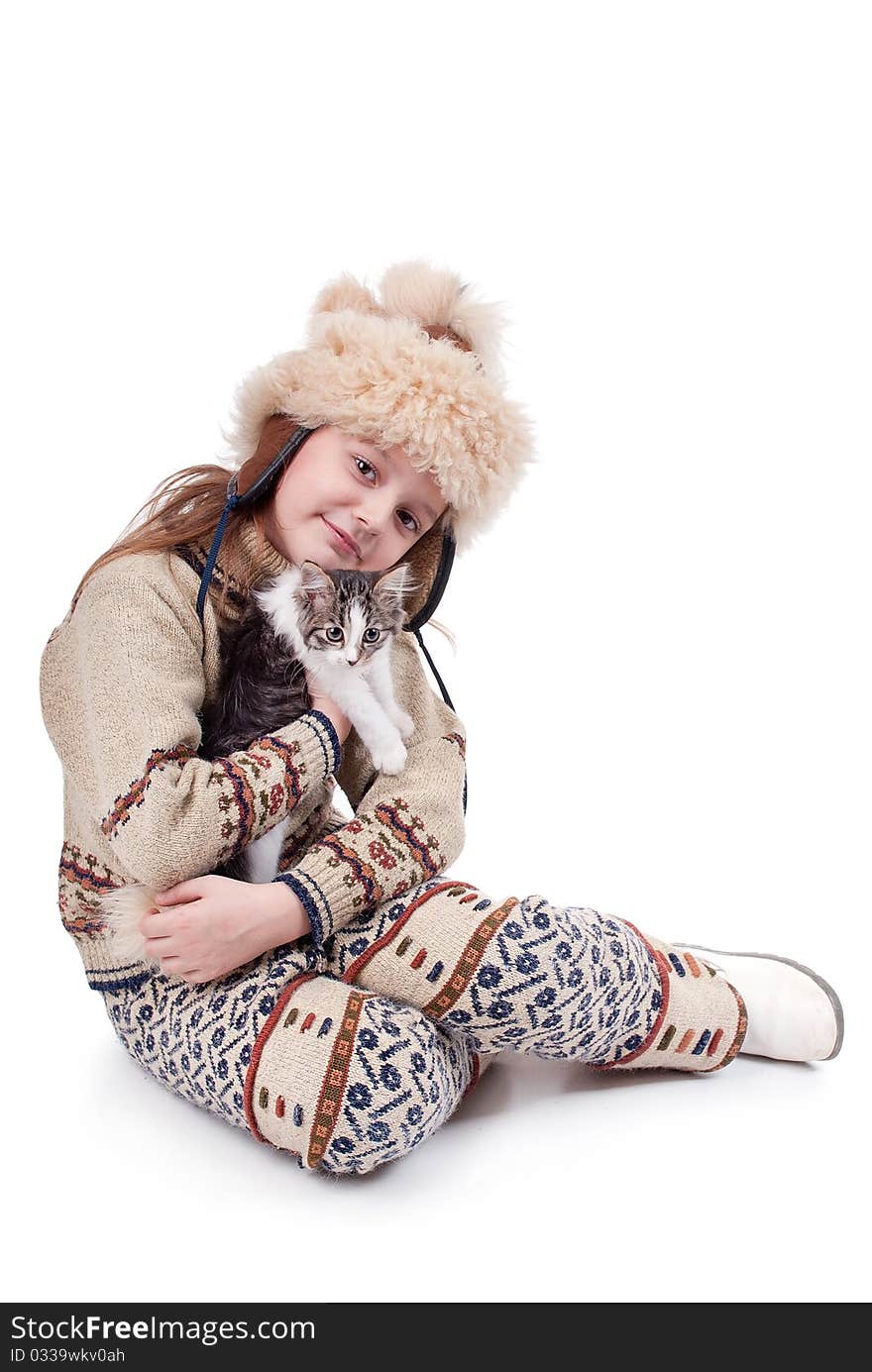 Little girl with a kitten in the hands isolated on white background