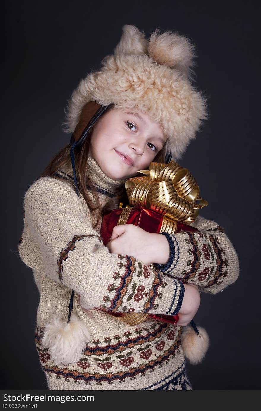 Happy little girl with Christmas present