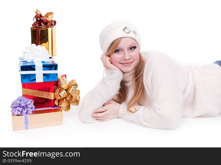 Beautiful girl with stack gift box. Isolated.