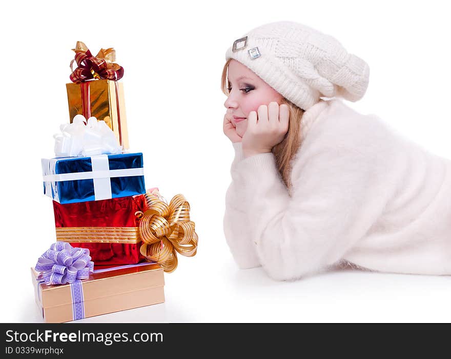 Beautiful girl with stack gift box. Isolated.