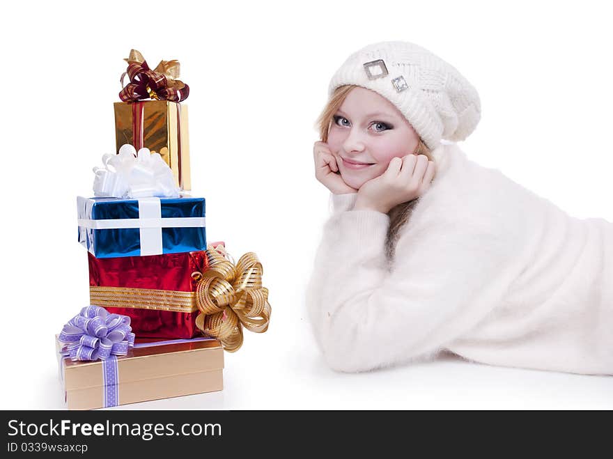 Beautiful girl with stack gift box. Isolated.