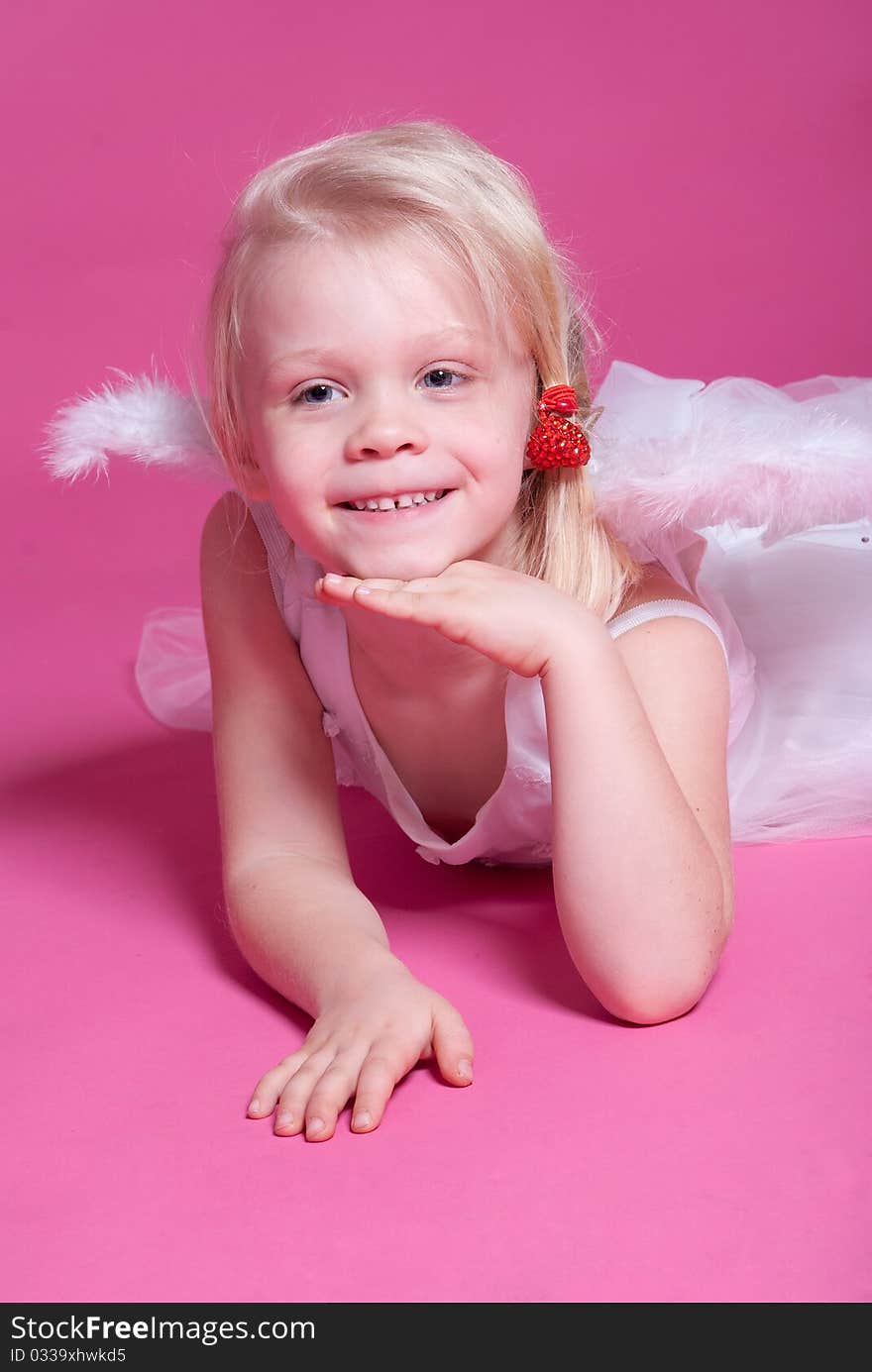 Little girl on pink studio background. Little girl on pink studio background