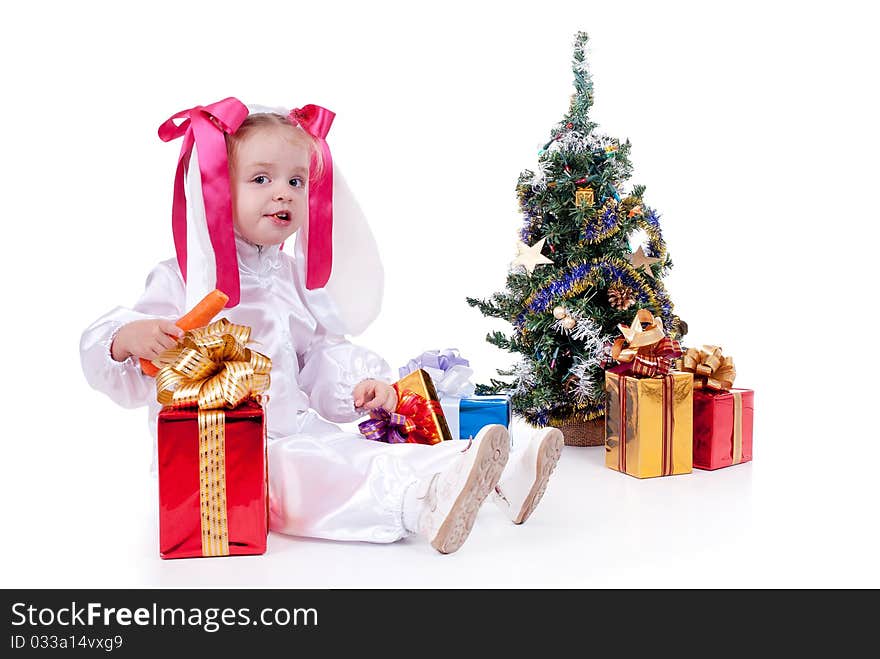 Child in a white downy bunny costume.