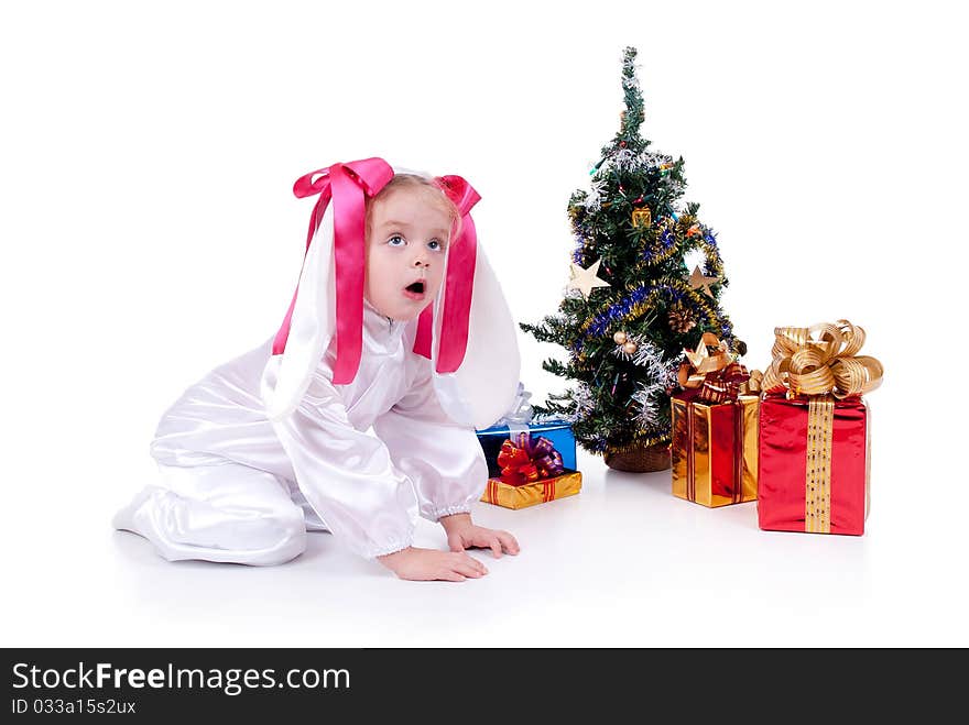 Child in a white downy bunny costume. Child in a white downy bunny costume.