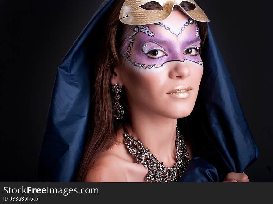 Studio portrait of a woman with art make-up