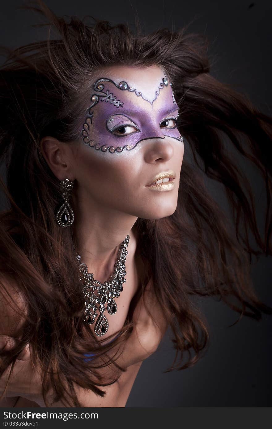 Studio portrait of a girl with art make-up