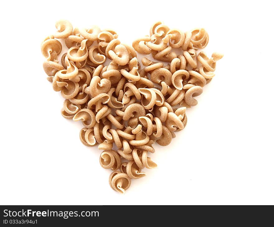 A pasta heart on white background