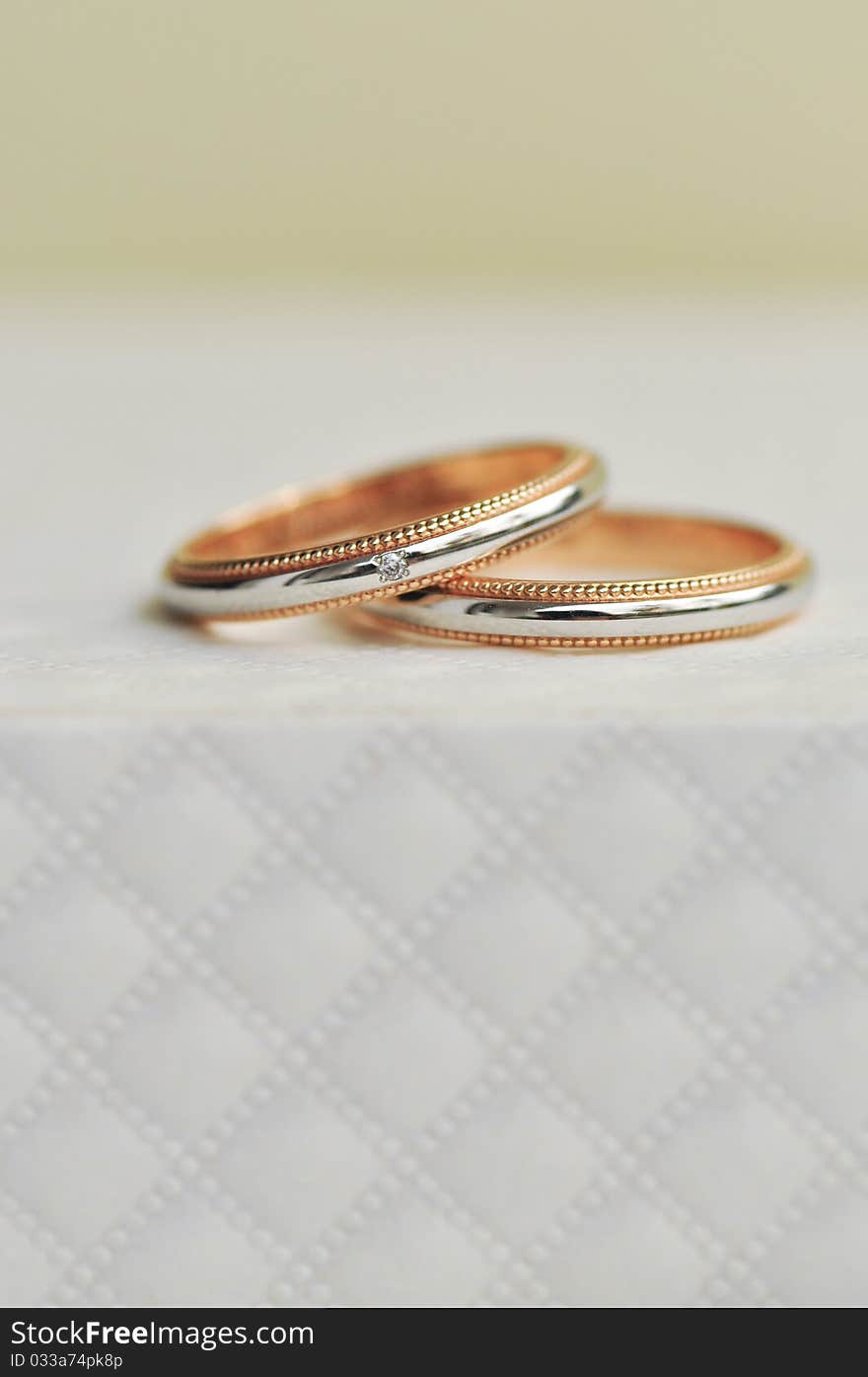 Pair Of Wedding Ring Sitting On Expensive Texture