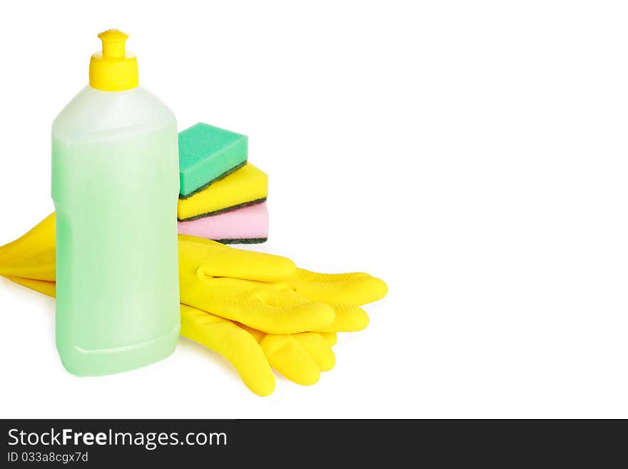 Yellow rubber gloves, vial of cleaning fluid and sponges isolated on white background. Yellow rubber gloves, vial of cleaning fluid and sponges isolated on white background