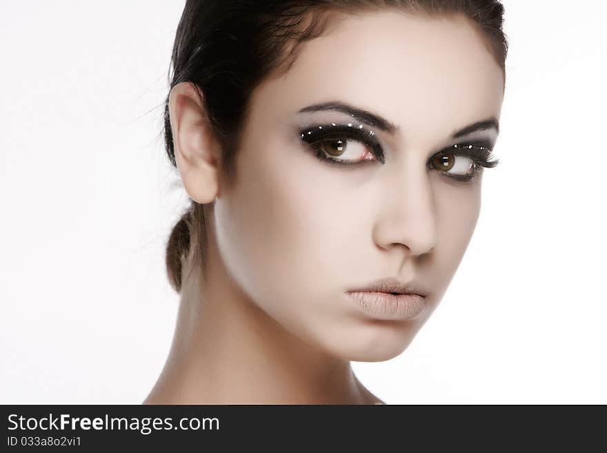 Studio portrait of young beautiful woman over white