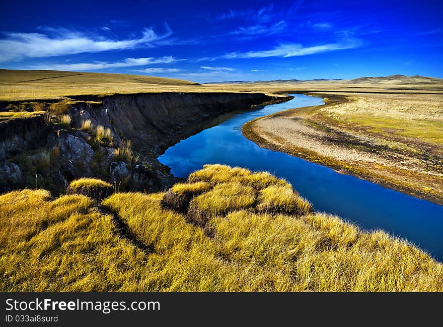 Stream between pastures and sky. Stream between pastures and sky.