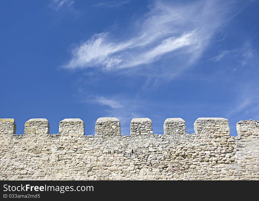 Merlons of an old fortress wall in a sunny day