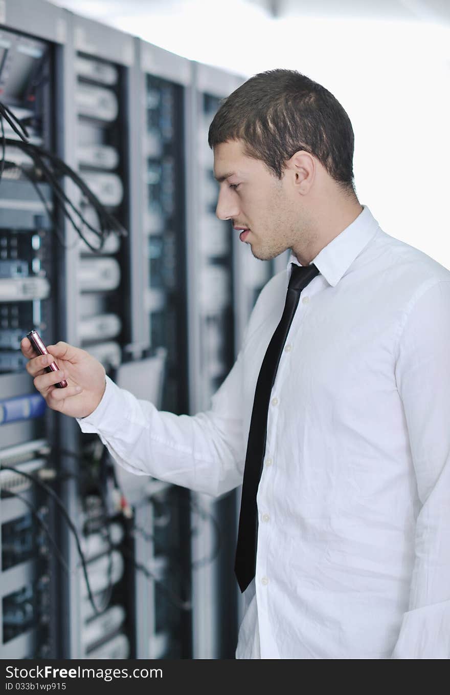 Young Engeneer In Datacenter Server Room