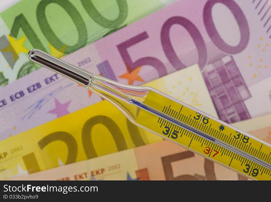 Medical thermometer and euro money. Medical thermometer and euro money