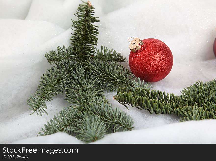 A Xmas bauble in a winter location. A Xmas bauble in a winter location