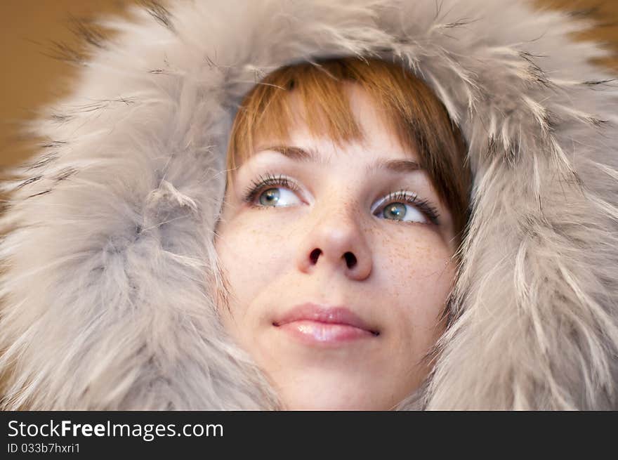 Young woman in a gray fur hood. Young woman in a gray fur hood