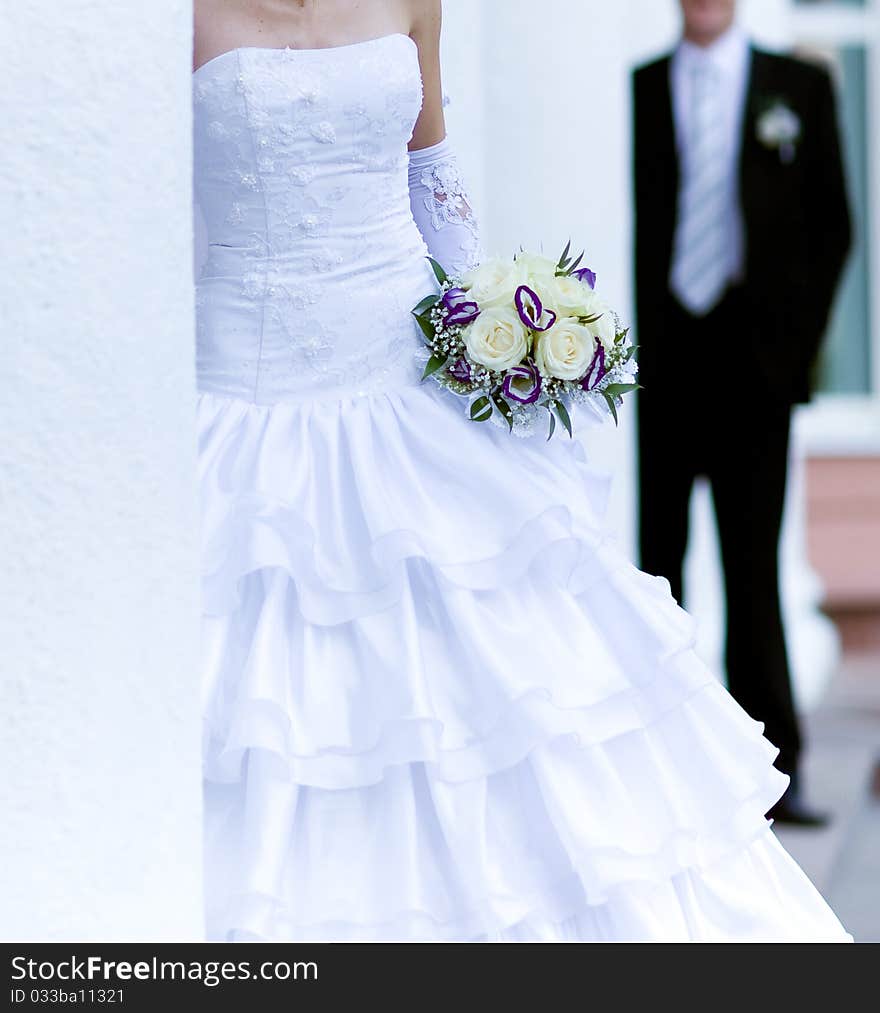 Bride holding bunch of flowers