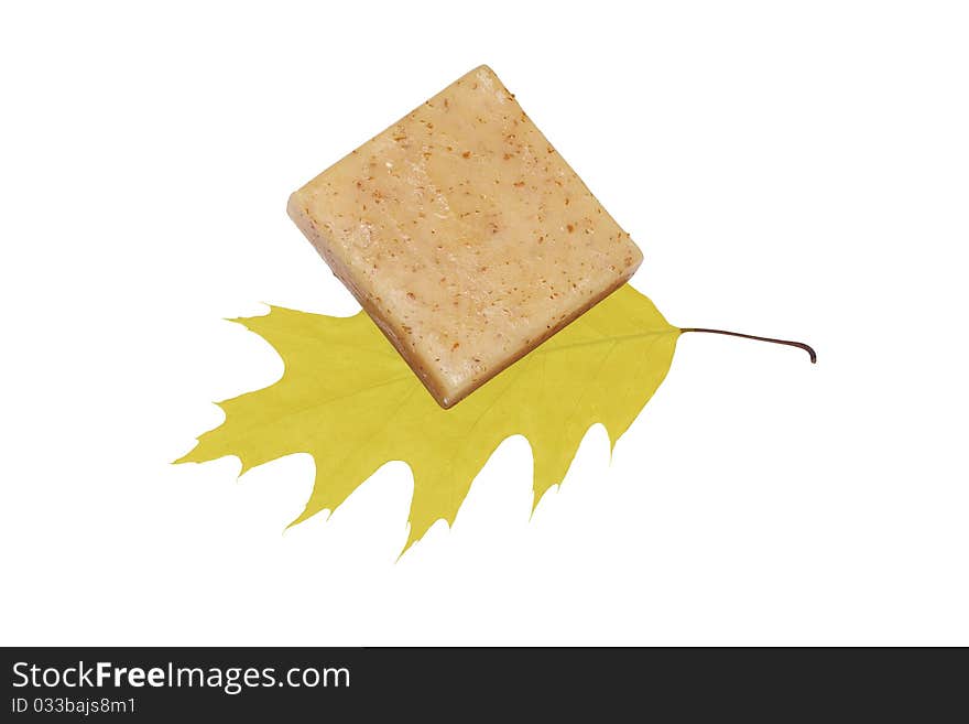 Spa towel and soap with yellow leaves