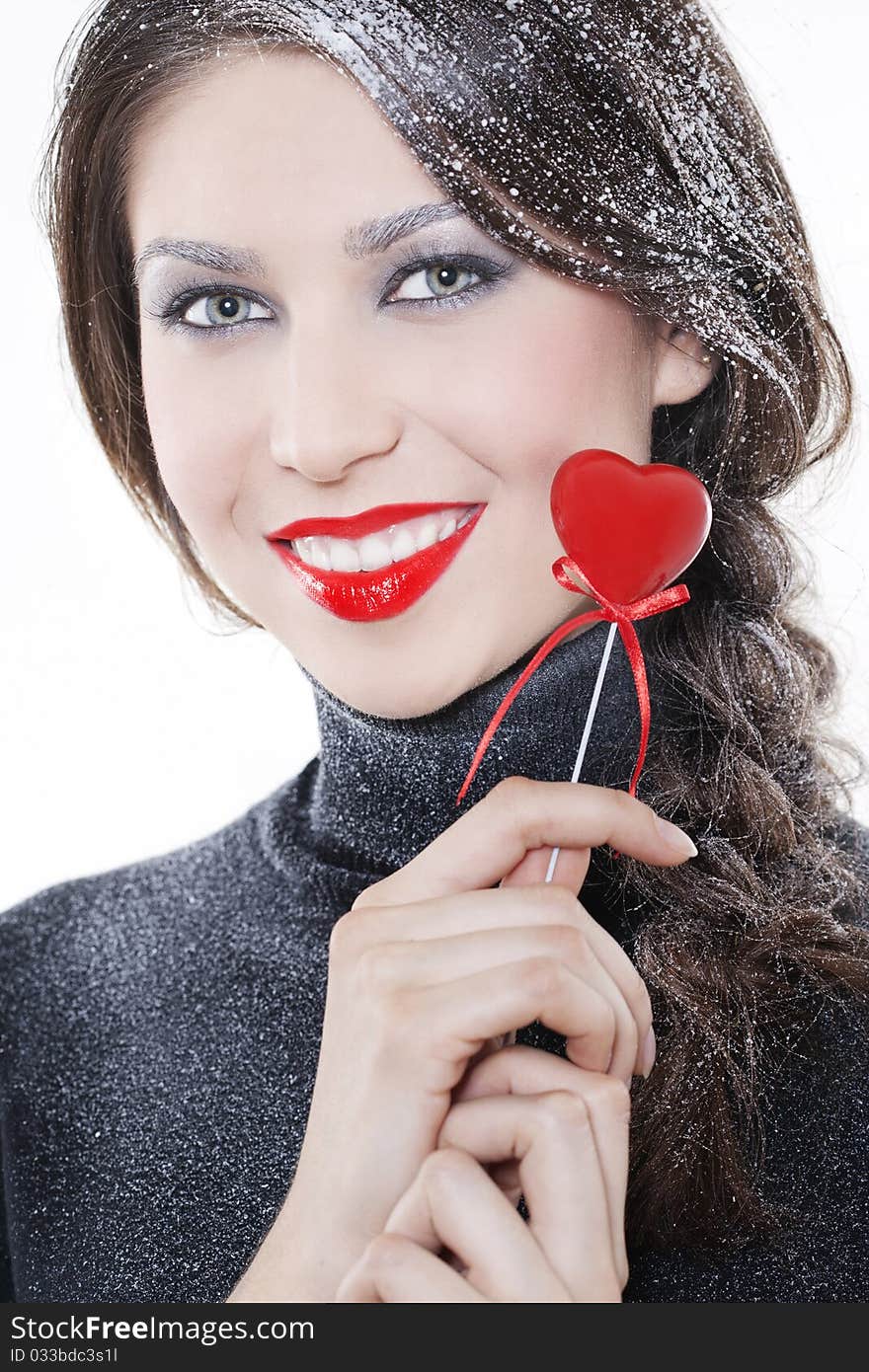 Beautiful smiling woman with heart on white background