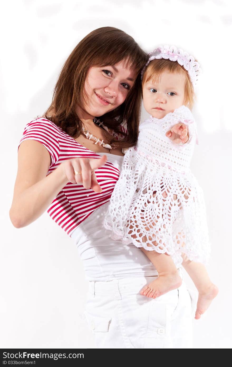 Mother and daughter pointing isolated on white