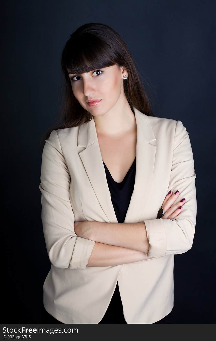 Stylish confident business woman in suit smiles