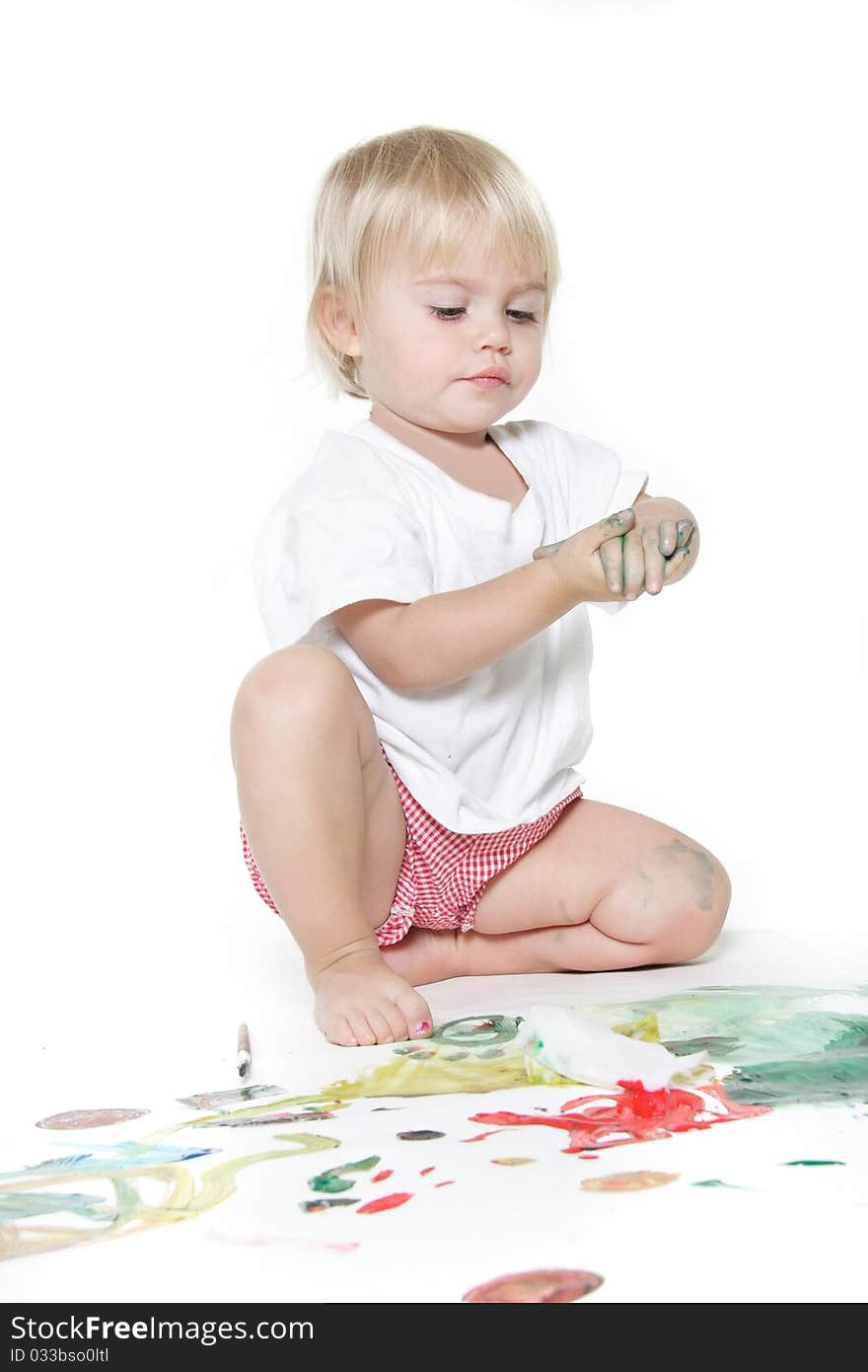 Cute child painting over white