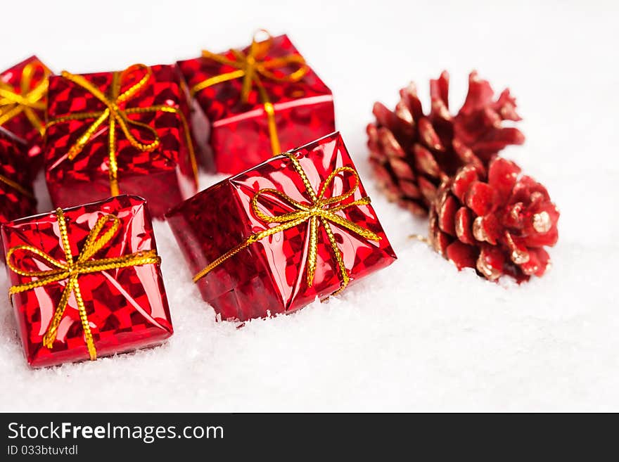 Red gift boxes with pinecone