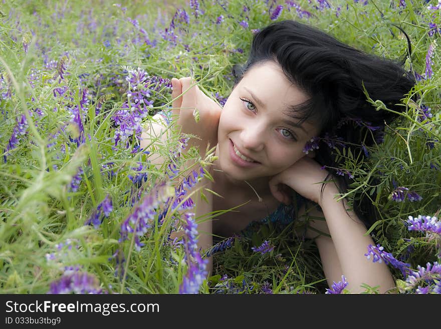 Beautiful Brunette Girl in blue flowers