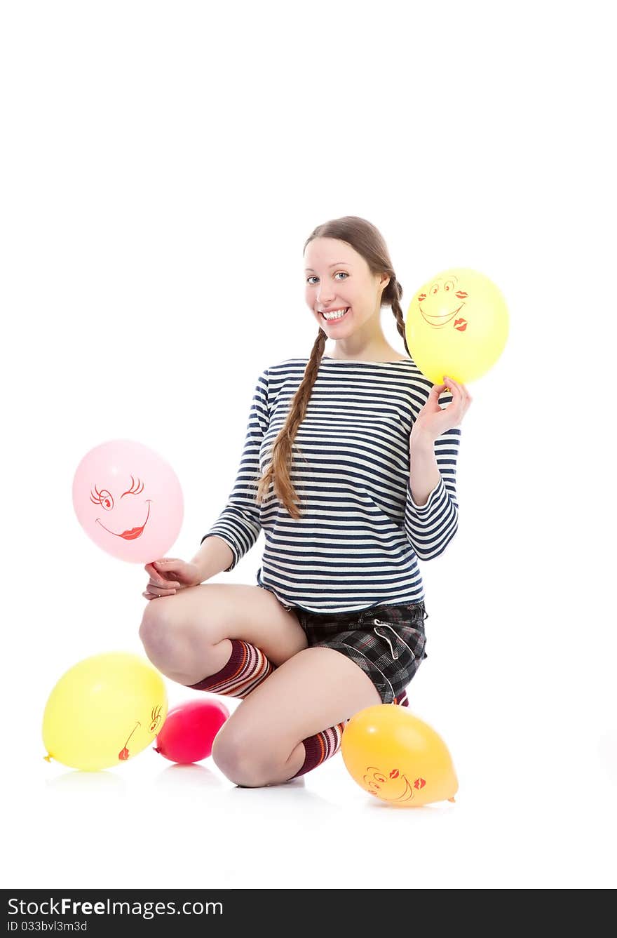 A pretty girl dressed in casual clothes playing with baloons. A pretty girl dressed in casual clothes playing with baloons