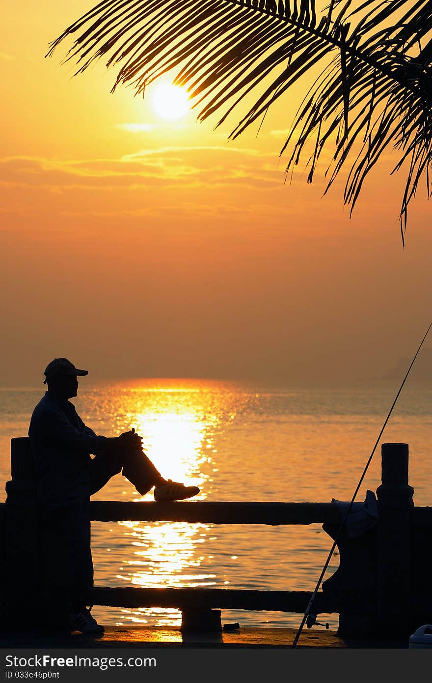 The seaside angles for fish to sit to take a rest on the railing in the morning. The seaside angles for fish to sit to take a rest on the railing in the morning