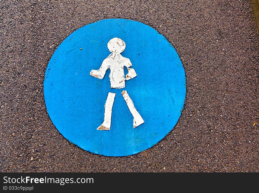 Symbol for pathway and icon for pedestrians on asphalt