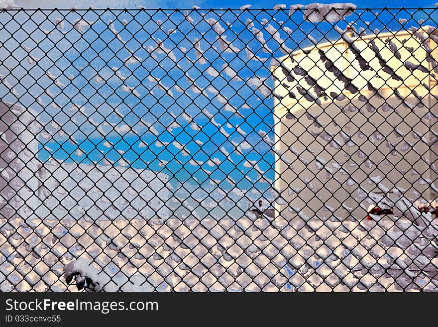 White tanks in tank farm with iron staircase in snow. White tanks in tank farm with iron staircase in snow