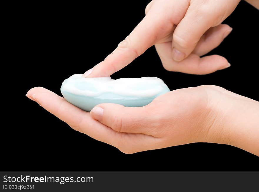 Soap in hand isolated on black background. Soap in hand isolated on black background