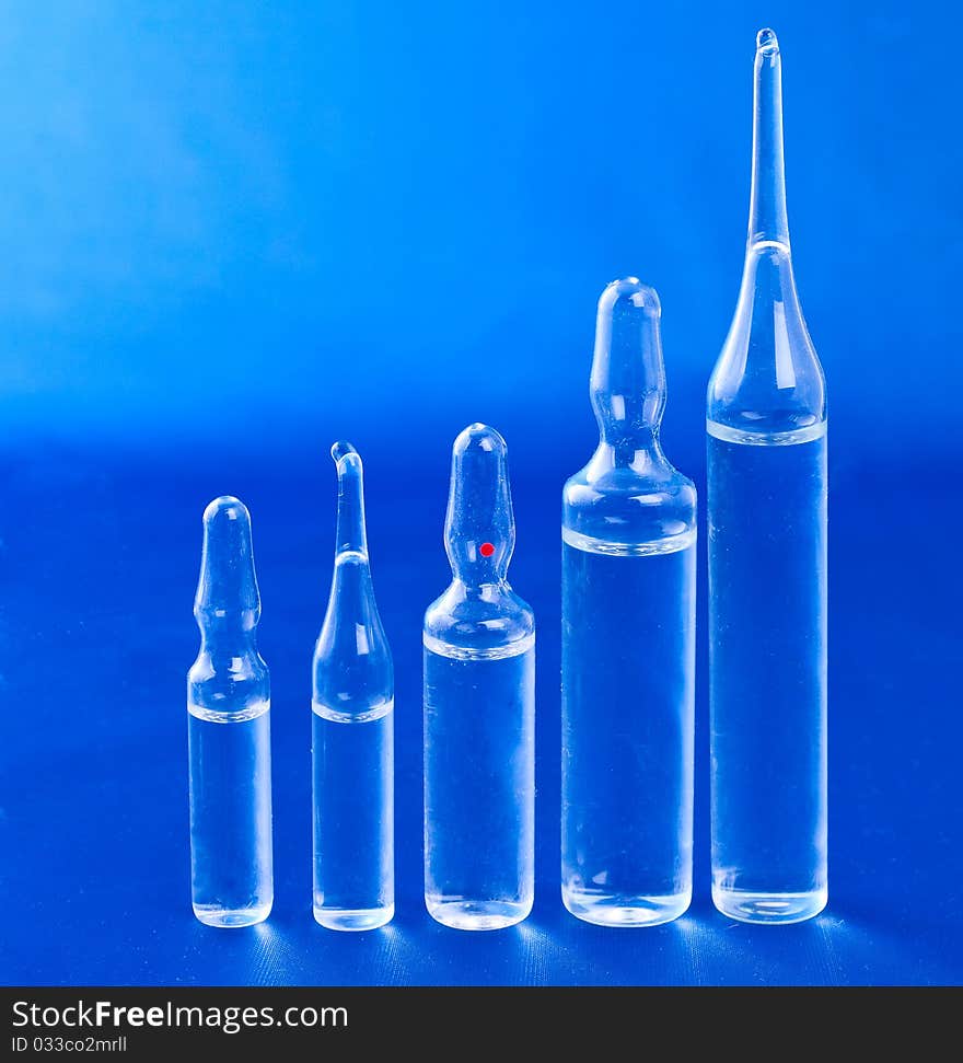 Ampoules on a blue background