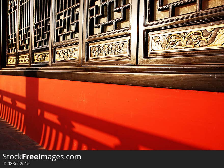 Traditional chinese windows in red wall. Traditional chinese windows in red wall