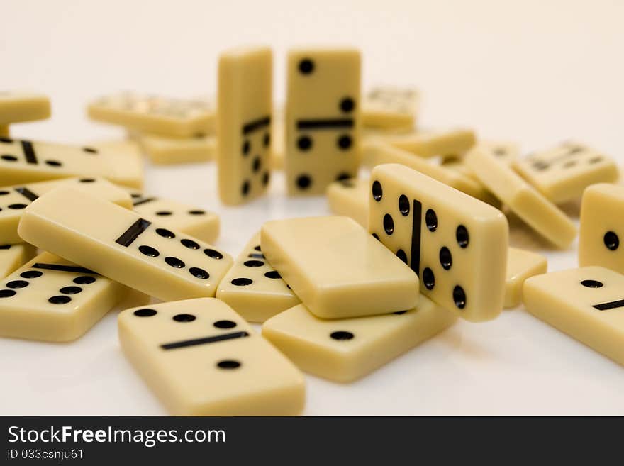 Domino-laying bricks on white background