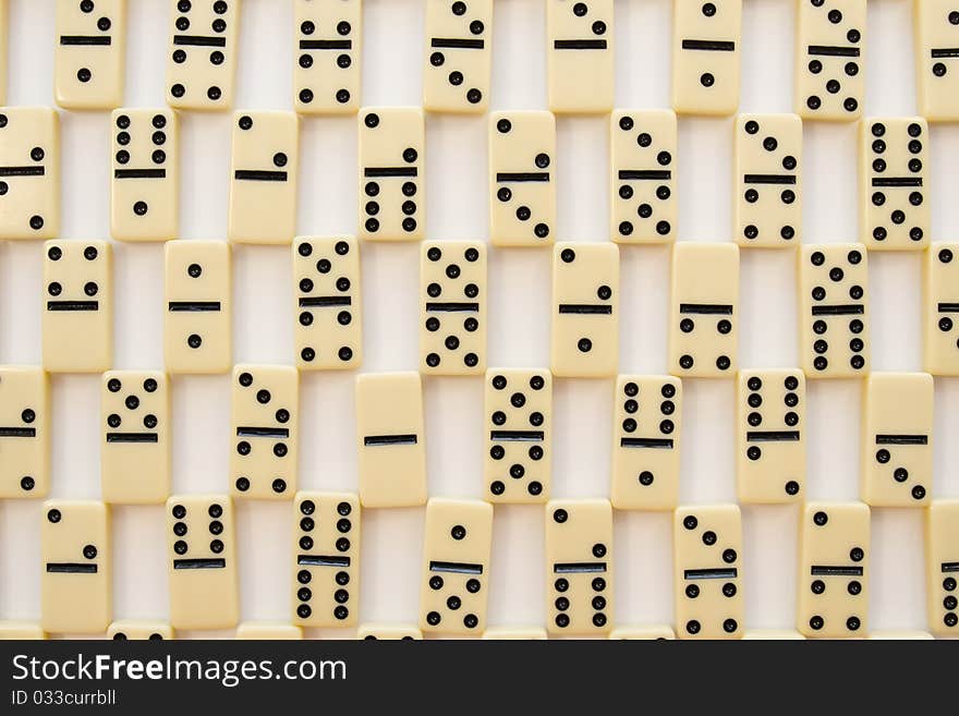 Domino-laying bricks on white background