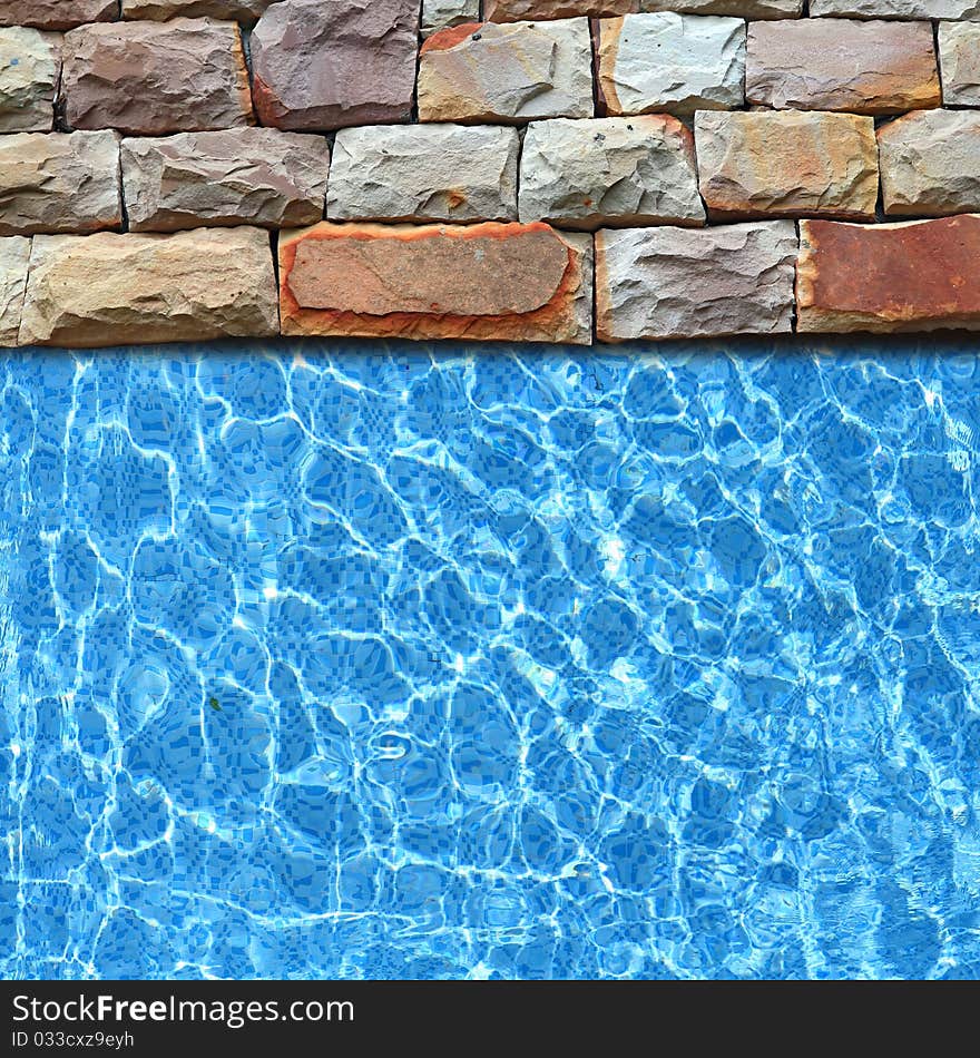 Modern stone pavement with pool edge background. Modern stone pavement with pool edge background