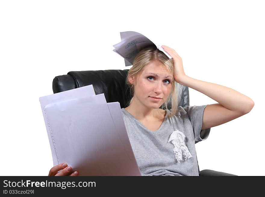 Desperate girl sitting in chair with paper sheets in hands