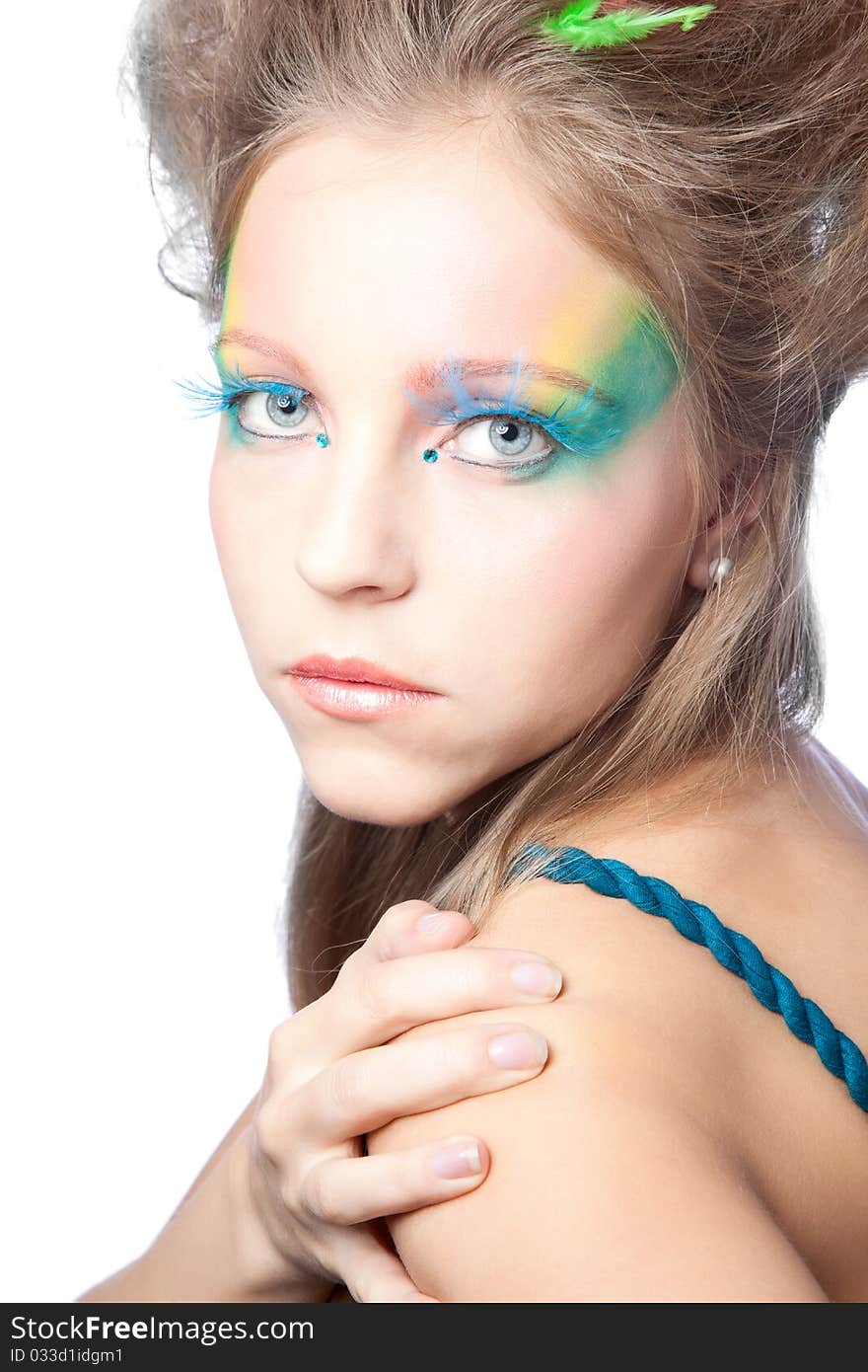 Beautiful woman  with color makeup over white background