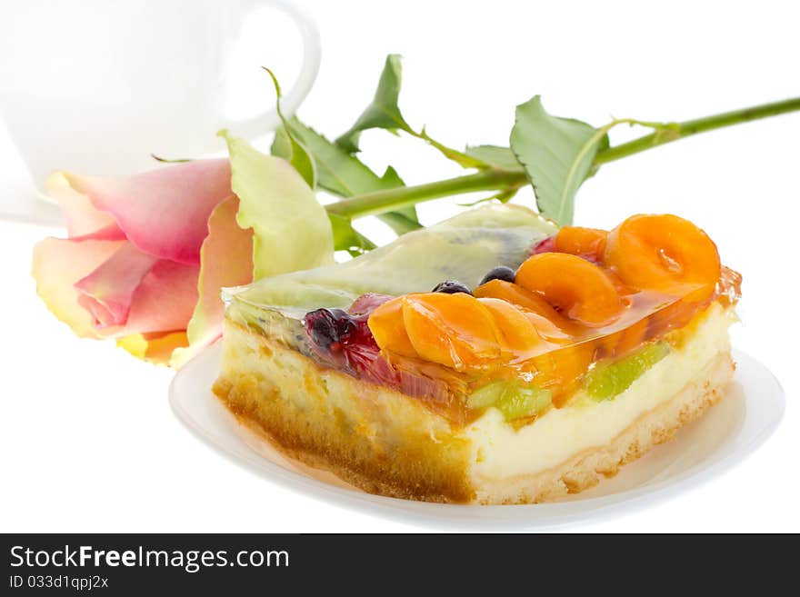 Close-up curd cake with fruits and rose, isolated on white