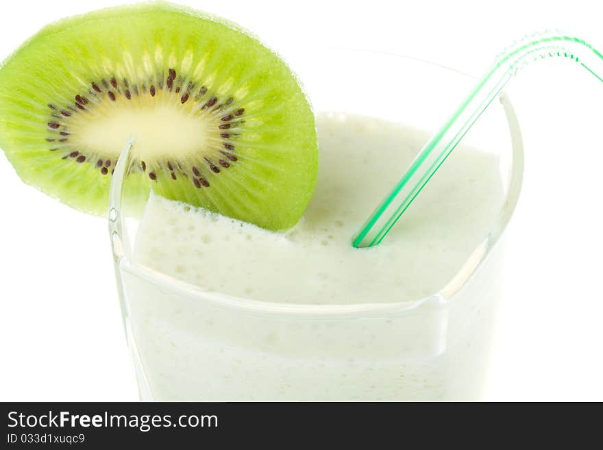 Close-up milk shake with kiwi and straw, isolated on white