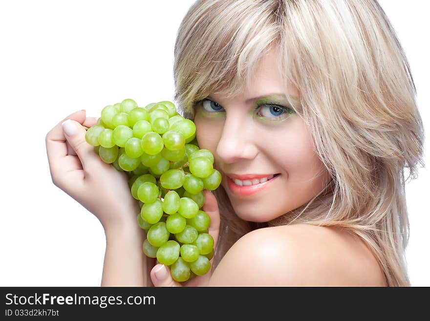 Beautiful woman over white background with grape. Beautiful woman over white background with grape