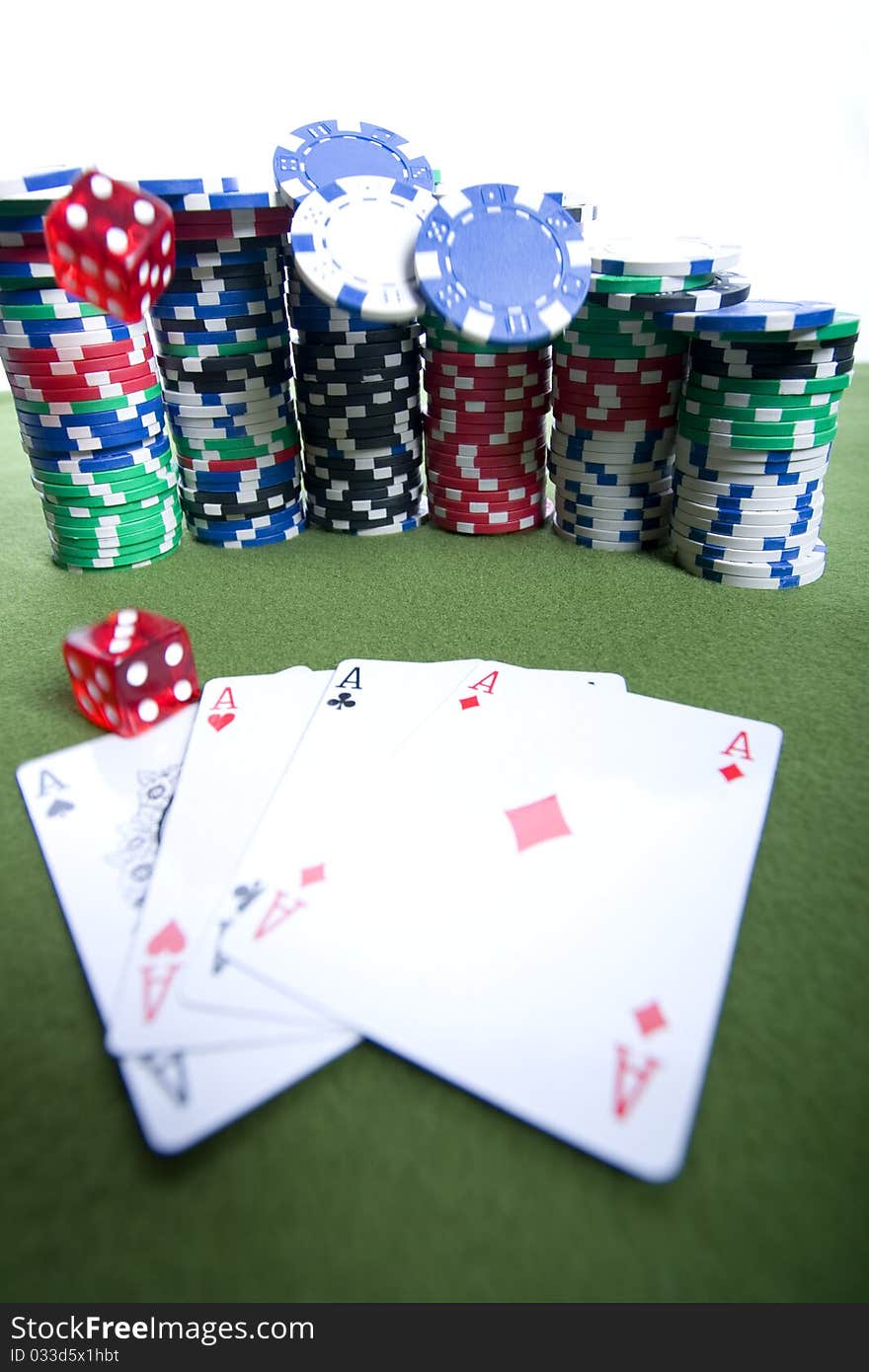 Red casino dice falling on a pile of poker chips. Red casino dice falling on a pile of poker chips