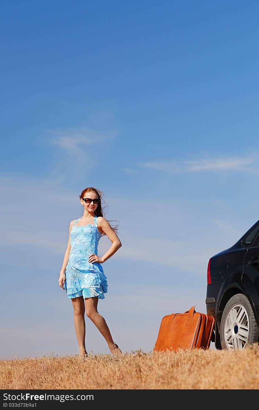 Young girl near the car