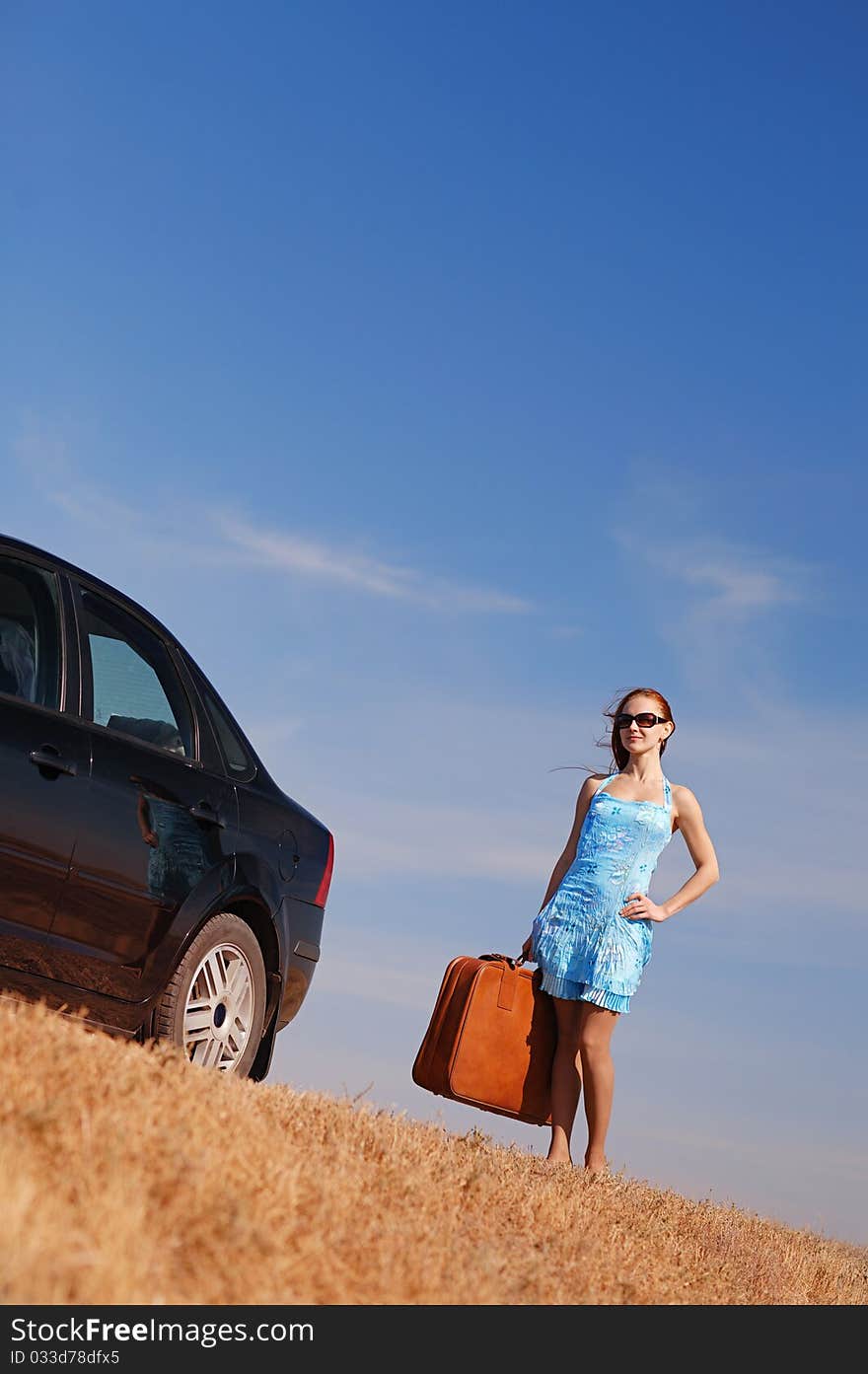 Young girl near the car