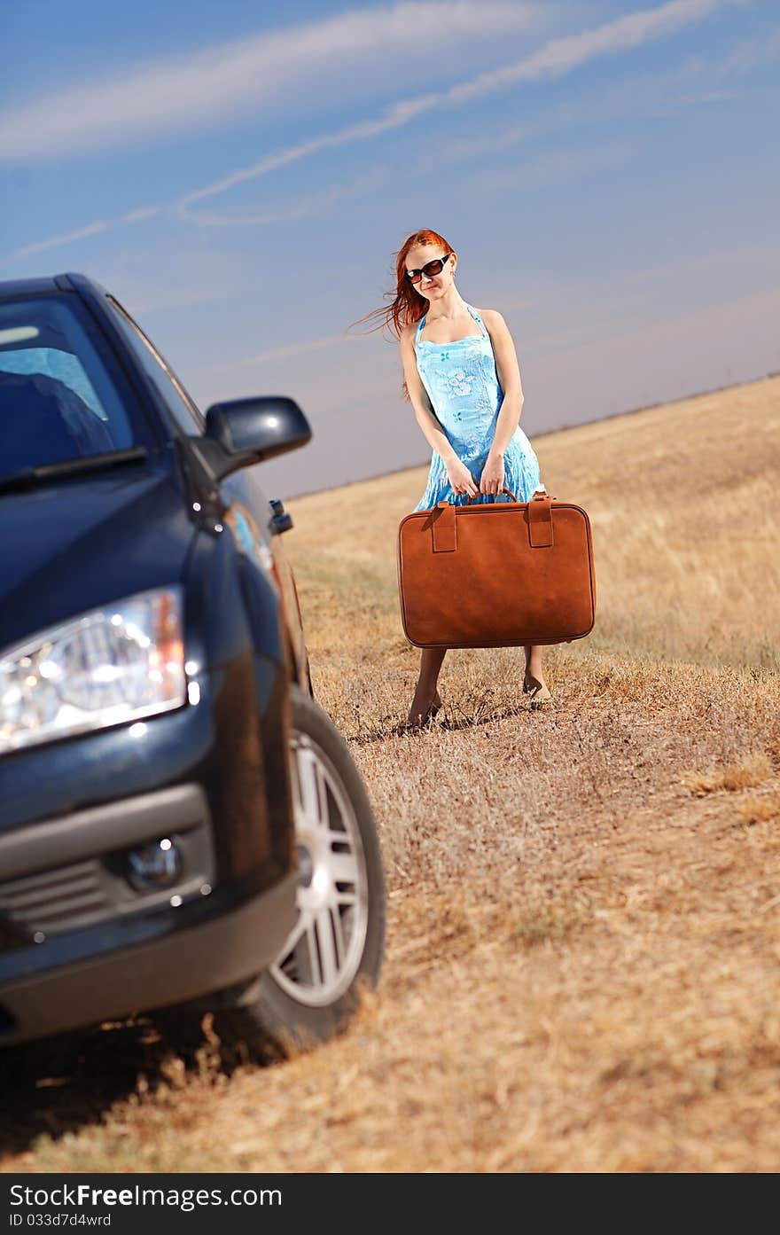 Young girl near the car