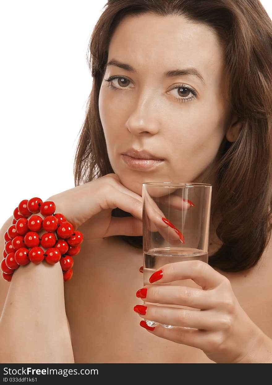 Girl with a glass in a red beads