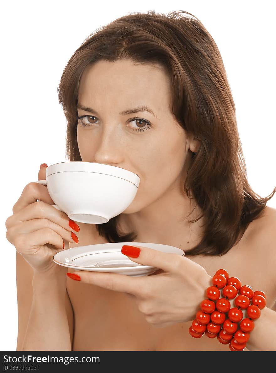 Young girl with a cup of tea and a red beads. Young girl with a cup of tea and a red beads