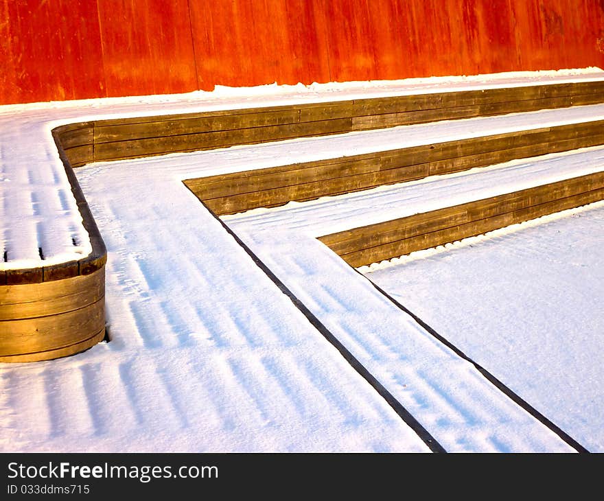 Abandoned park bench  in winter